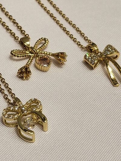 Collar Surtido Moño Dorado